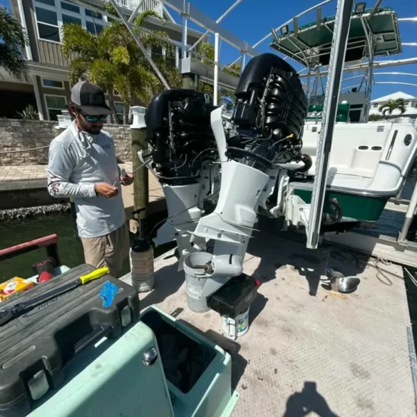 Island-Marine-Repair-LLC-technician-performing-full-service-on-twin-Suzuki-175hp-outboard-motors-at-residential-waterfront-dock-in-Southwest-Florida-768×1024-1